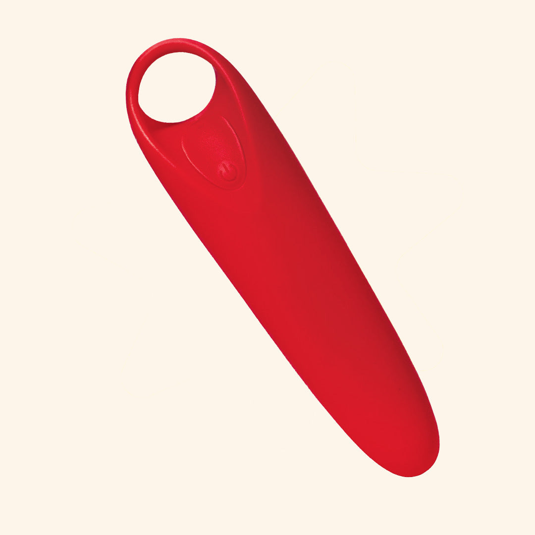 Red Candy handheld massager with sleek design and  ergonomic finger grip at the top, placed on a plain background