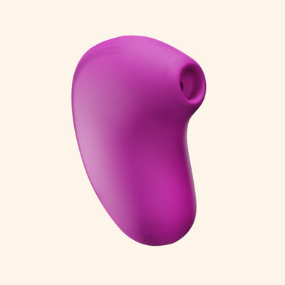 LIT suction massager in purple with plain background, sleek design for women.