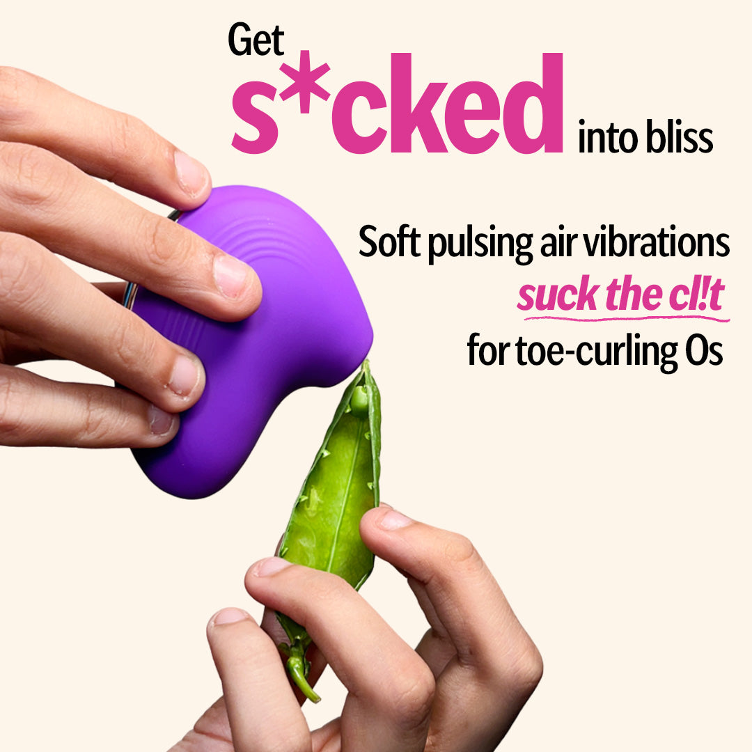 Hand holding LIT suction massager in purple with pea pod demo showing pulsing air vibrations.