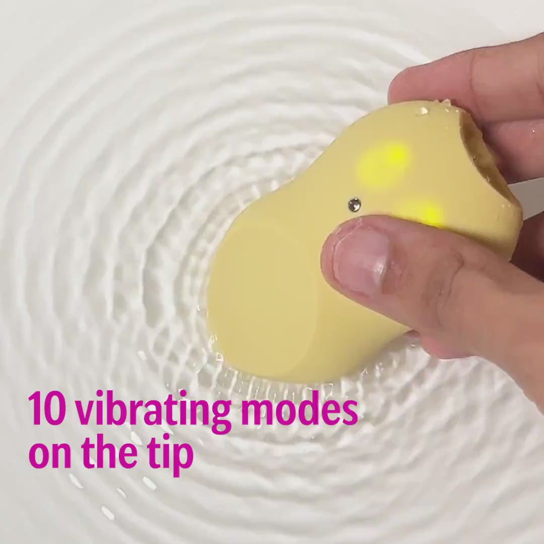 Yellow tongue massager with vibrating tip in water