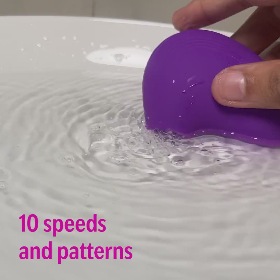 LIT suction massager in purple shown underwater demo with 10 speeds and vibration patterns.