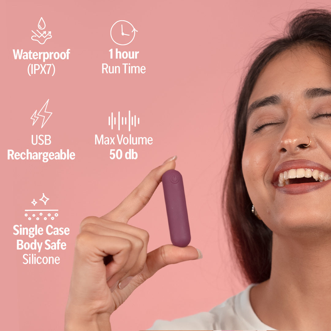 Woman holding plum bullet massager with features listed