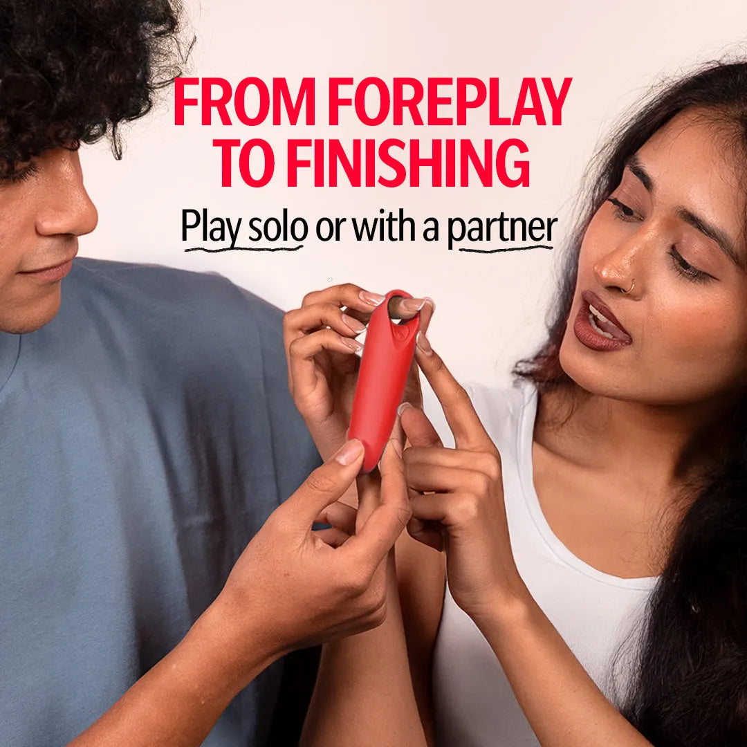 Couple holding red Candy handheld massager, designed for solo or partner 
use.