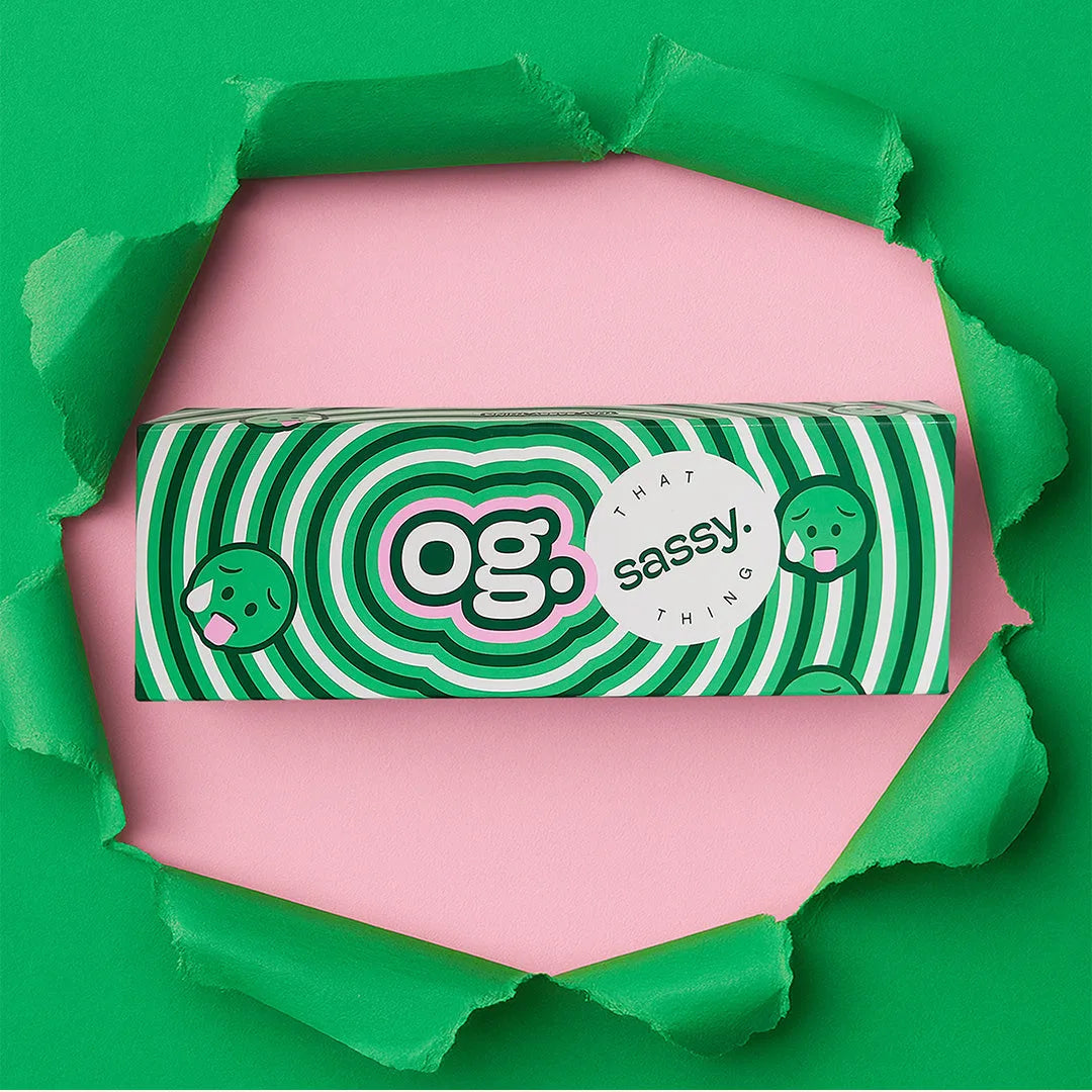 OG female personal massager box packaging with green striped design by That 
Sassy Thing.