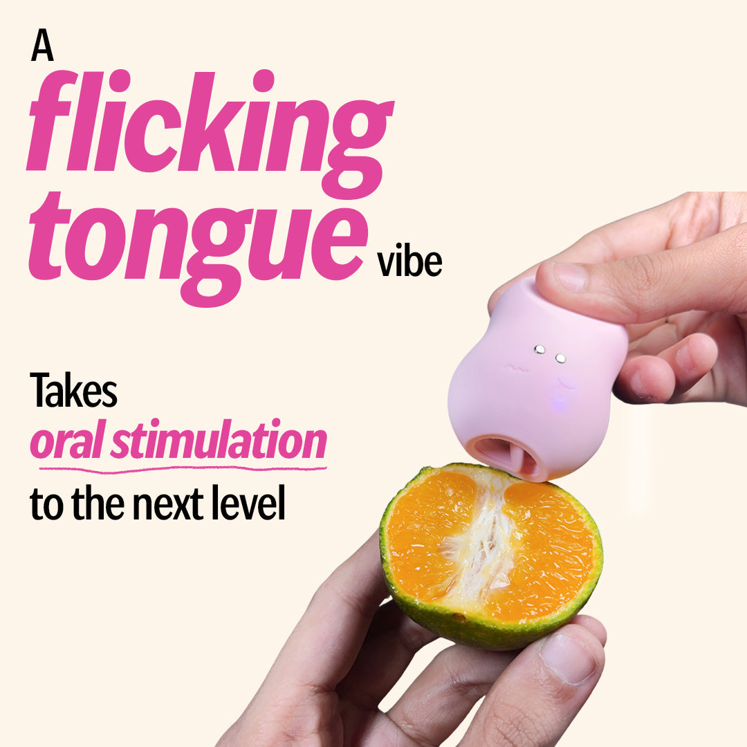 Pink tongue massager with orange fruit demo