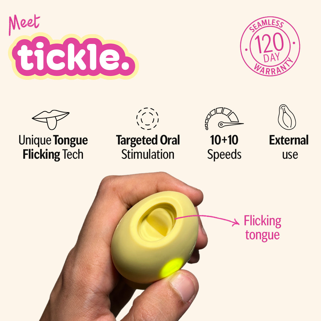 Yellow tongue licking massager held in hand with features in background