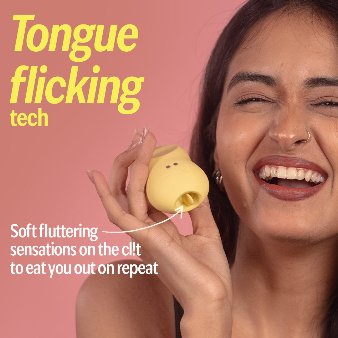 Woman holding yellow tongue massager with flicking tech